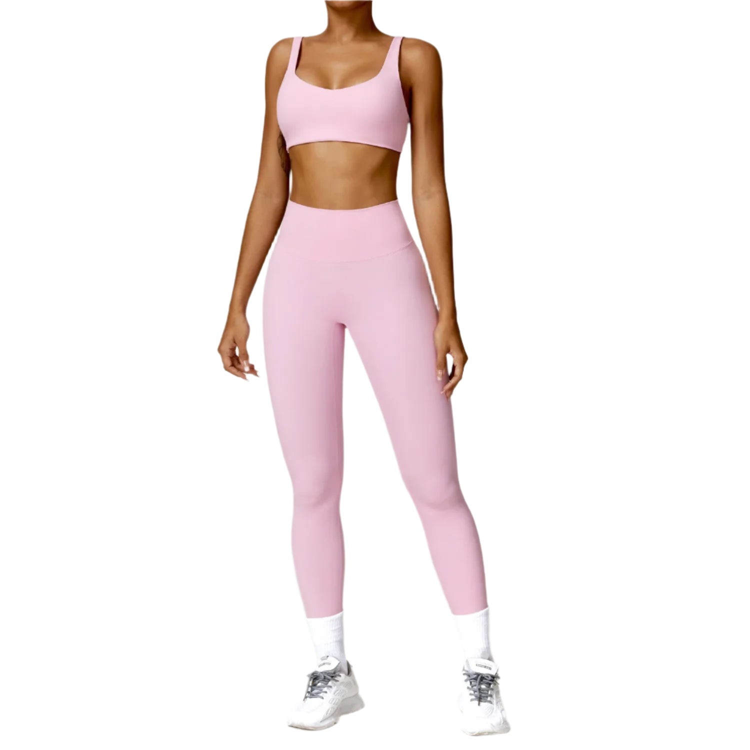 Person wearing a pink athletic outfit on a white background