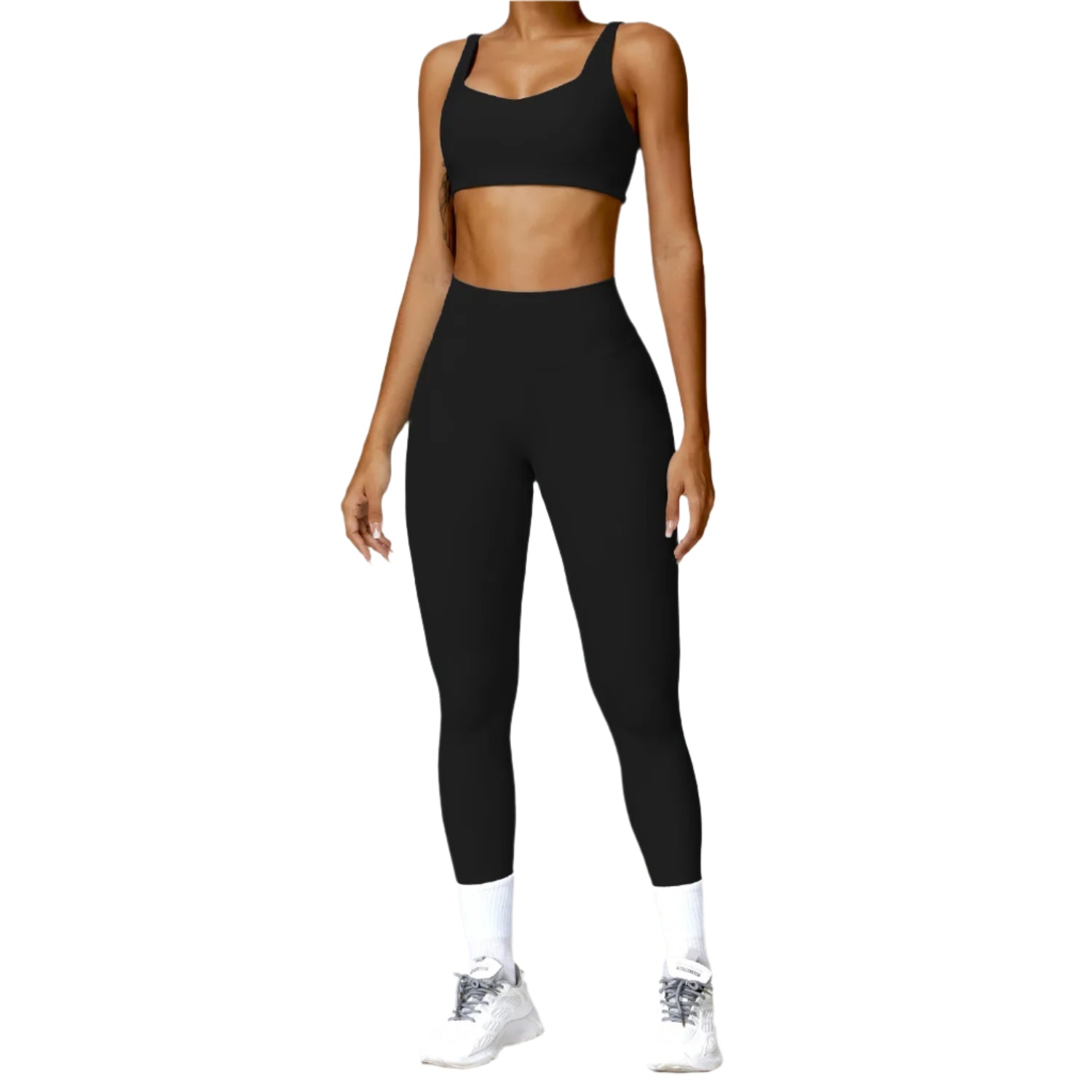 Person wearing a black sports bra and leggings set on a white background