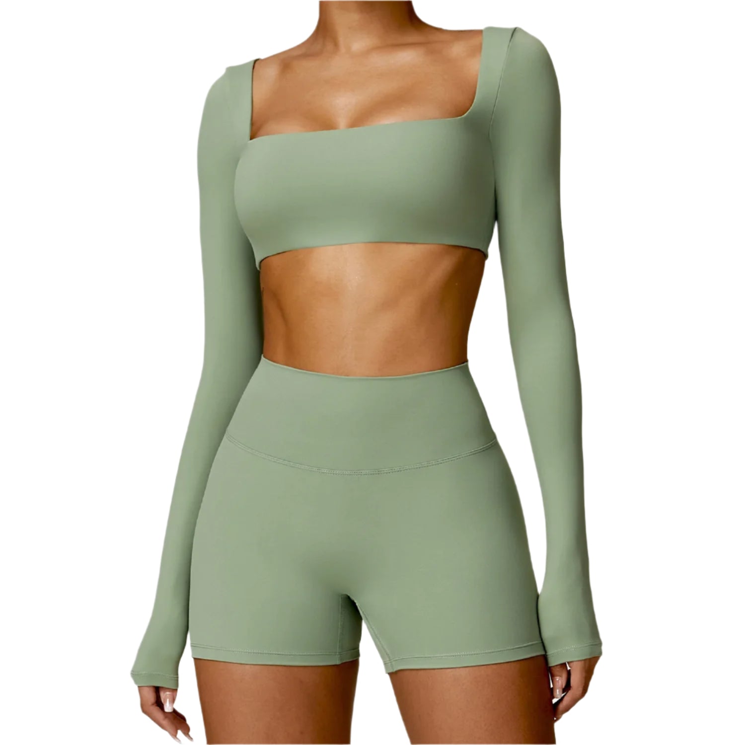 Green athletic outfit with long-sleeve top and shorts on a white background